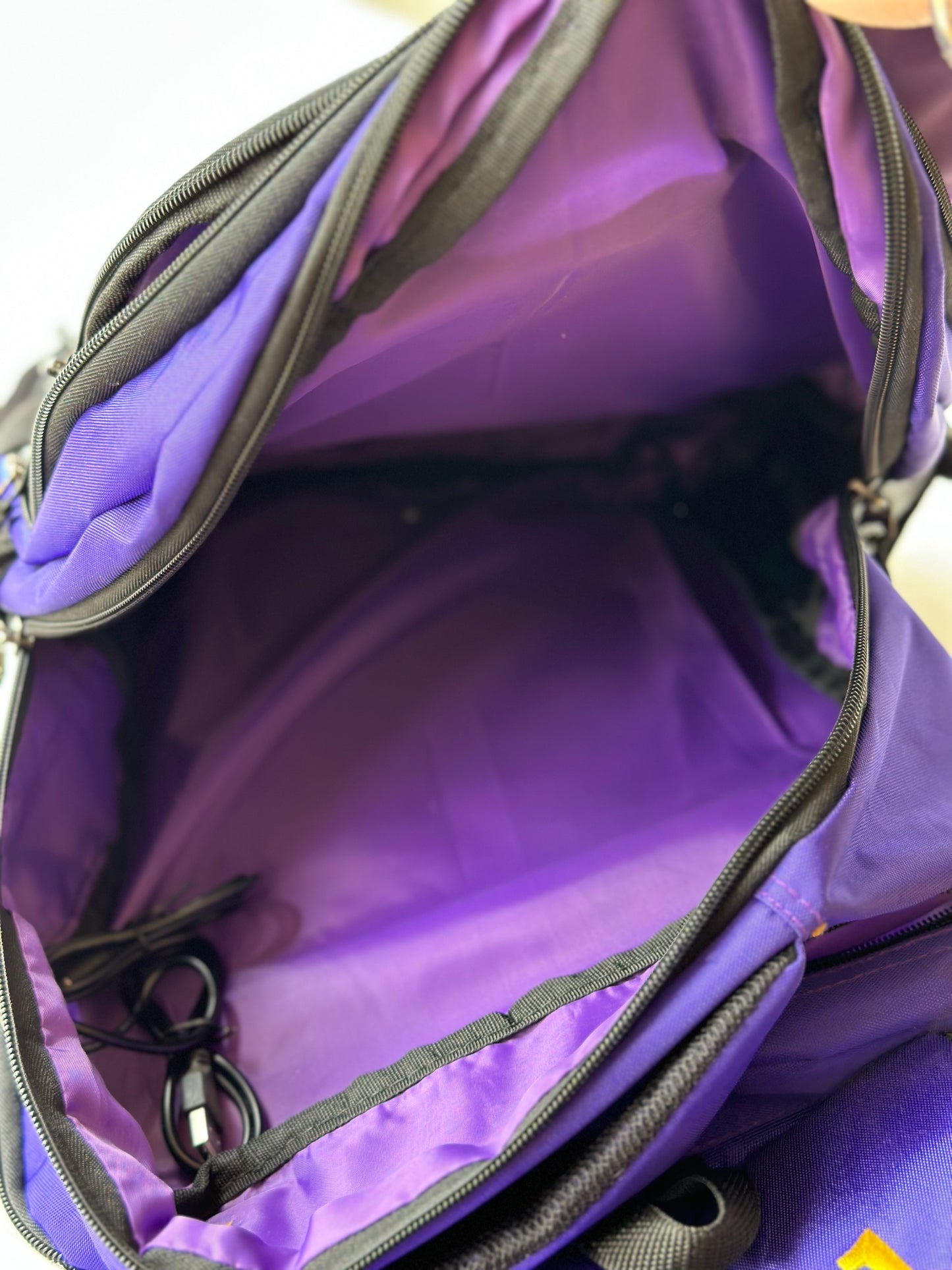 Omega Psi Phi (ΩΨΦ) Fraternity Royal Purple Stylish, Polyester Fabric Coated College Backpack with laptop sleeves For Men, Made in India.