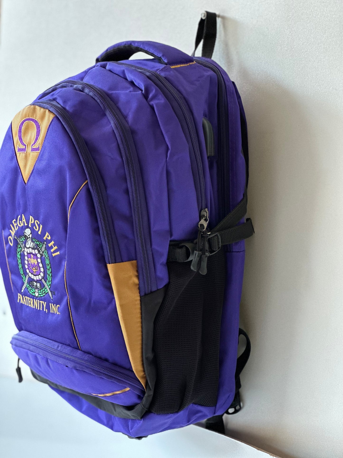 Omega Psi Phi (ΩΨΦ) Fraternity Royal Purple Stylish, Polyester Fabric Coated College Backpack with laptop sleeves For Men, Made in India.