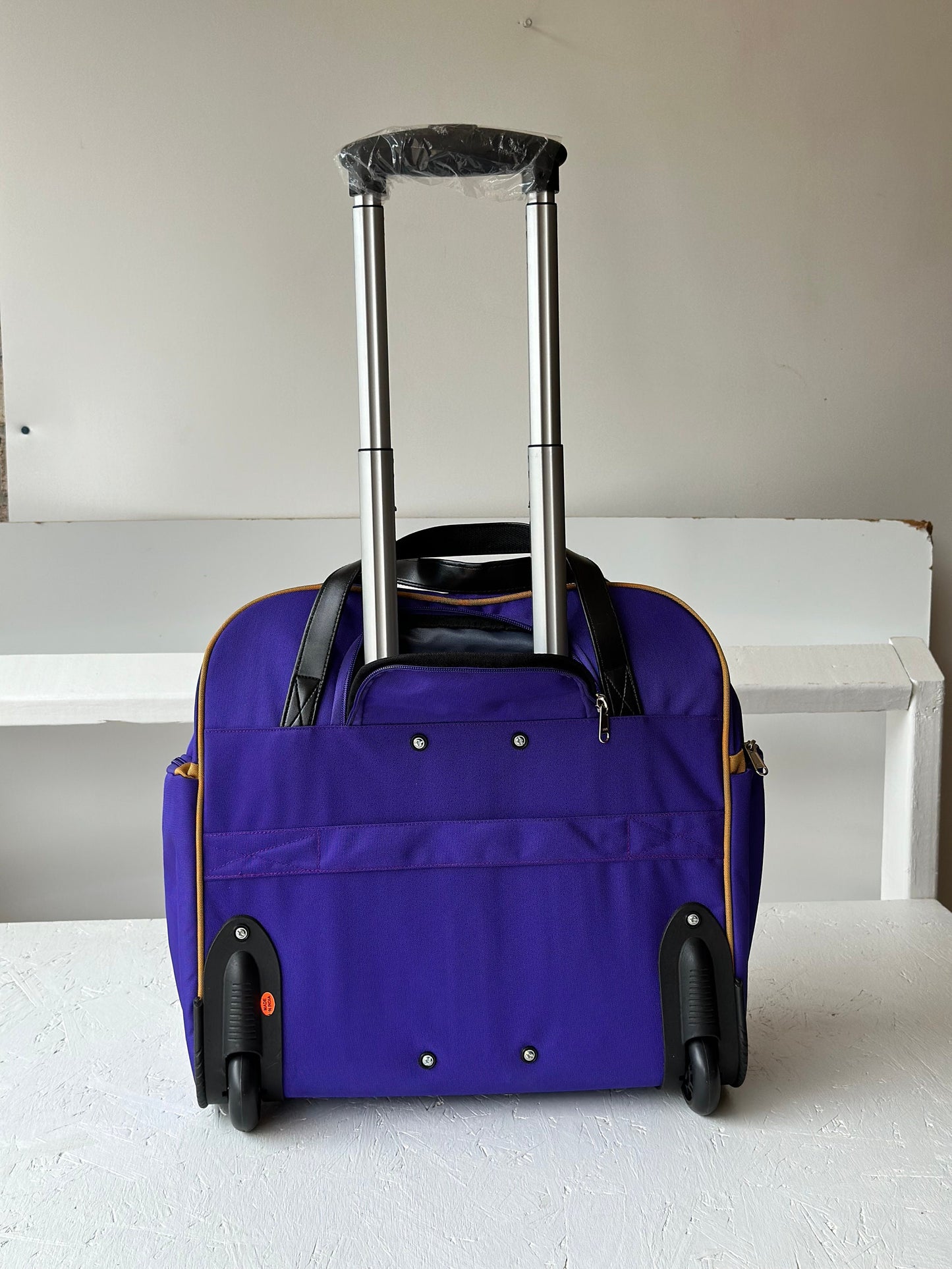 Omega Psi Phi Fraternity Royal Purple & Old Gold color Laptop with Trolley- Luggage/cabin Bag for travelling.- authorized vendor