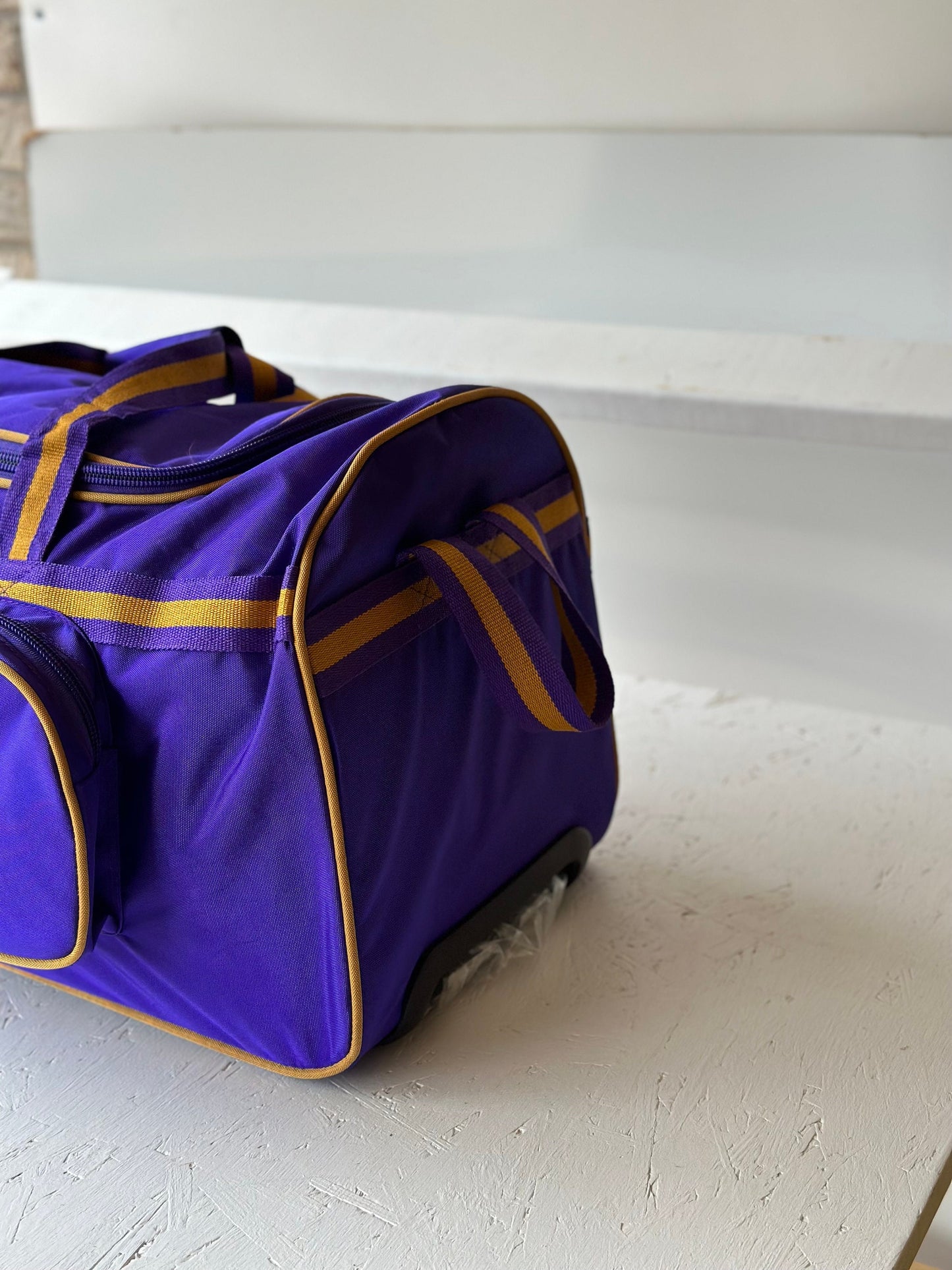 Omega Psi Phi Fraternity Royal Purple & Old Gold color Trolley/ Duffle/ Luggage Bag for travelling.- authorized vendor