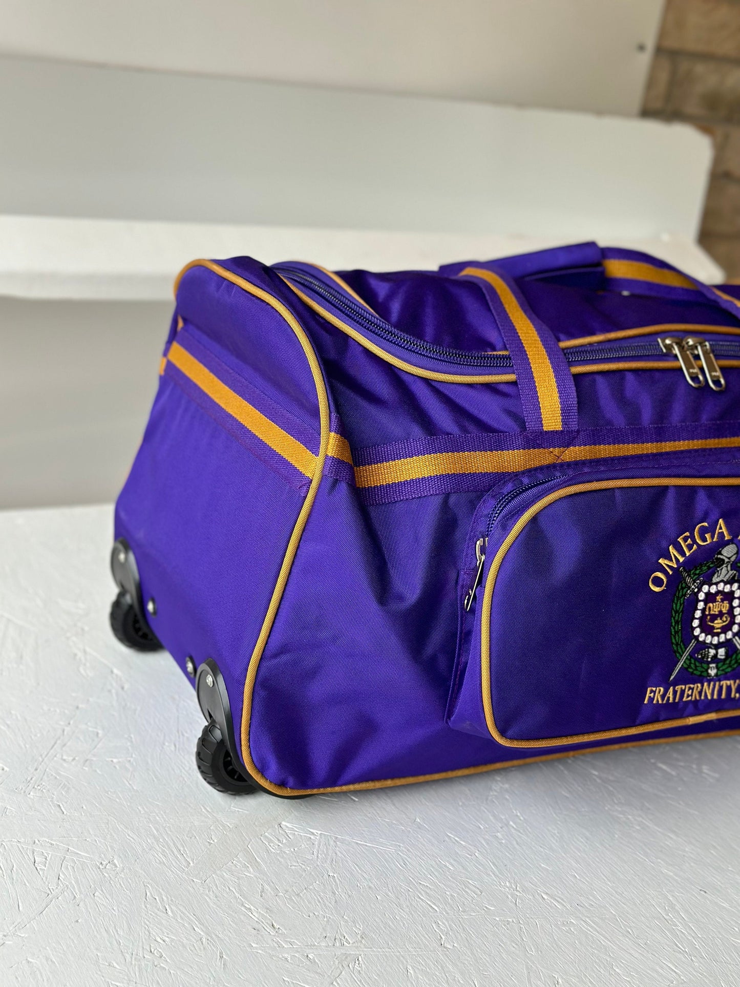 Omega Psi Phi Fraternity Royal Purple & Old Gold color Trolley/ Duffle/ Luggage Bag for travelling.- authorized vendor