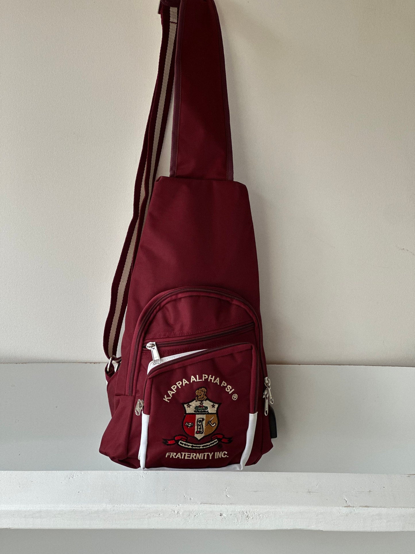 Kappa Alpha Psi Fraternity, single Shoulder Crossbody Sling/Shoulder bag with USB Port, Embroidered Organizational Shield in Front