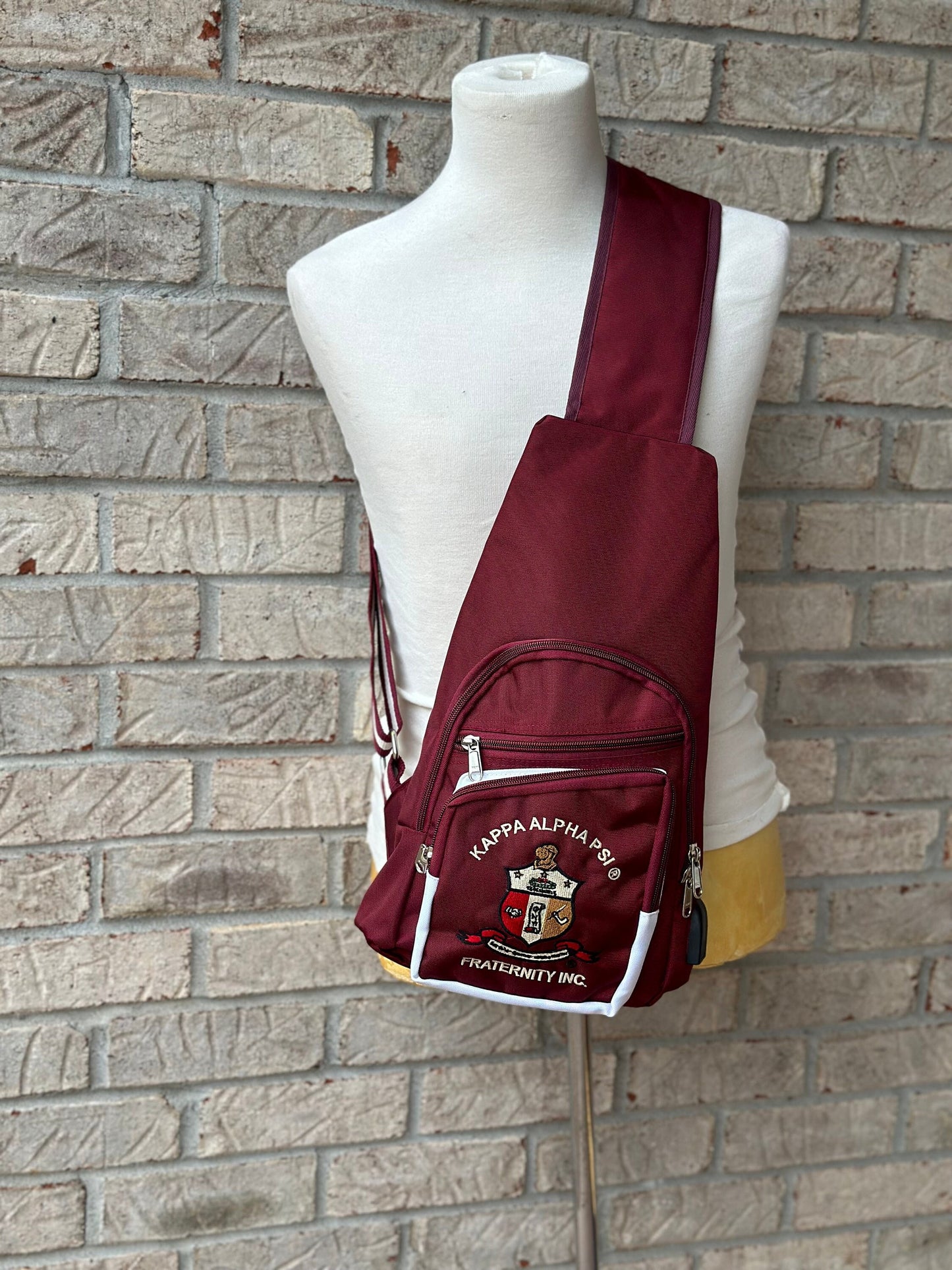Kappa Alpha Psi Fraternity, single Shoulder Crossbody Sling/Shoulder bag with USB Port, Embroidered Organizational Shield in Front