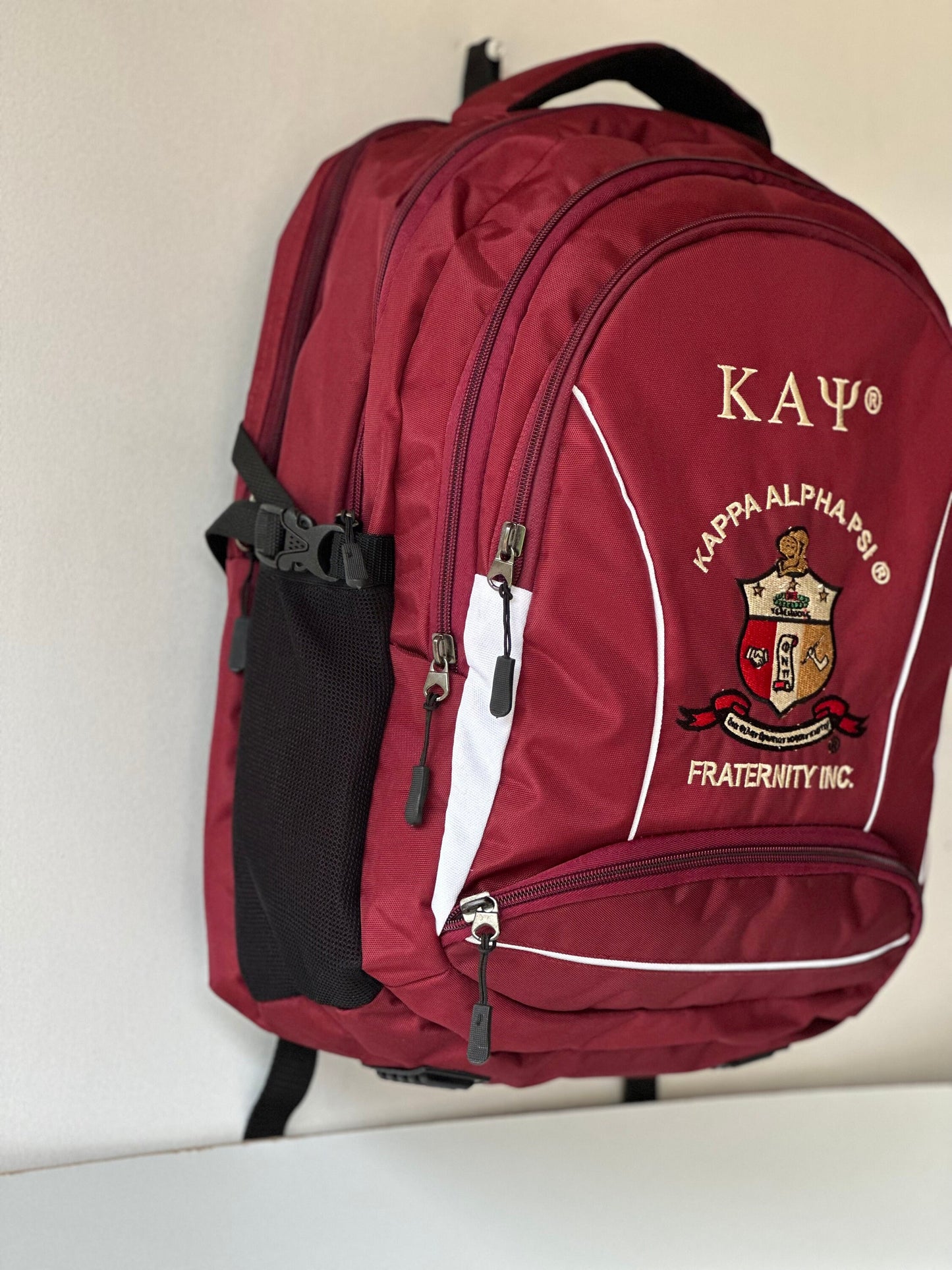 Kappa Alpha Psi (KAΨ) Fraternity Crimson & Black Stylish, Polyester Fabric Coated College Backpack with laptop sleeves For Men.