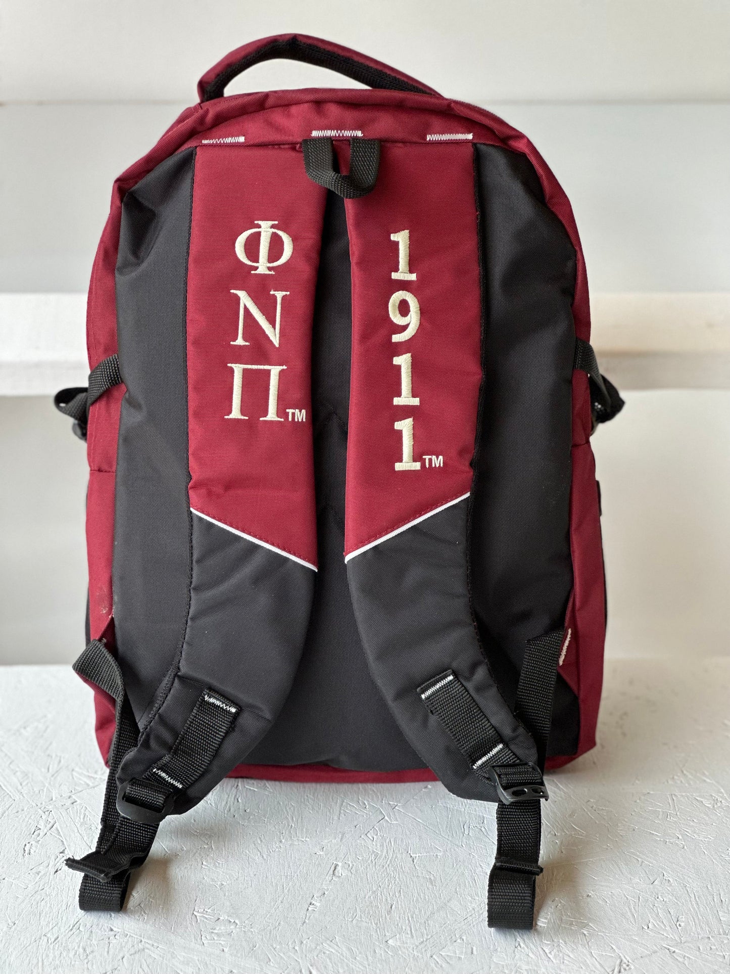Kappa Alpha Psi (KAΨ) Fraternity Crimson & Black Stylish, Polyester Fabric Coated College Backpack with laptop sleeves For Men.