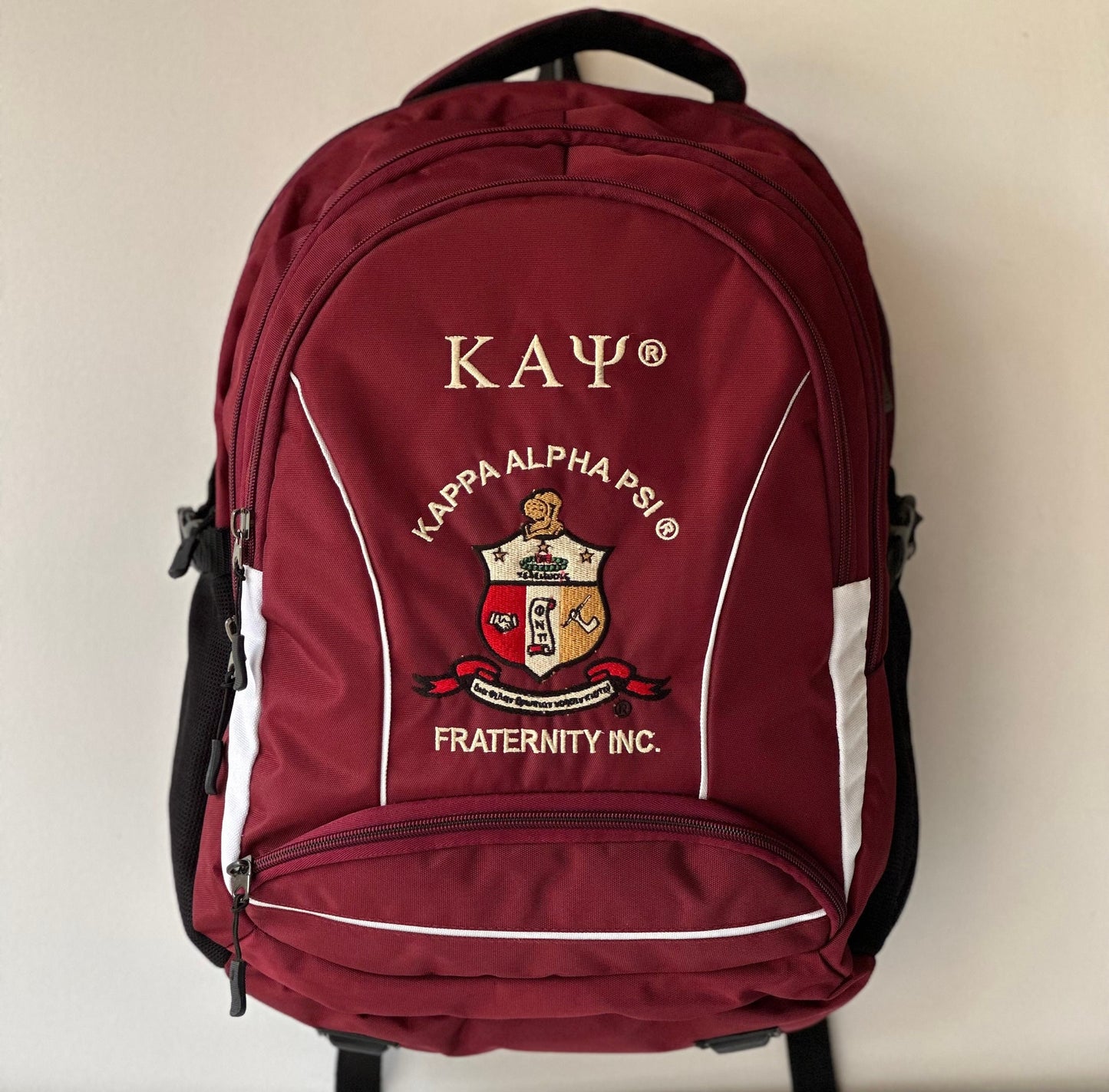 Kappa Alpha Psi (KAΨ) Fraternity Crimson & Black Stylish, Polyester Fabric Coated College Backpack with laptop sleeves For Men.