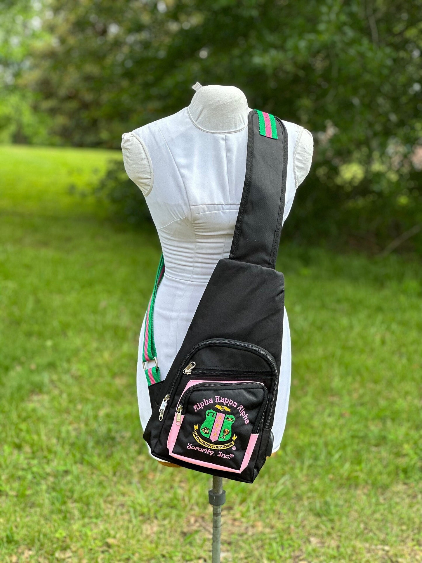 Alpha Kappa Alpha (AKA) Black or Pink One Shoulder Crossbody Sling/Shoulder bag with USB Port, Embroidered Organizational Shield in Front.