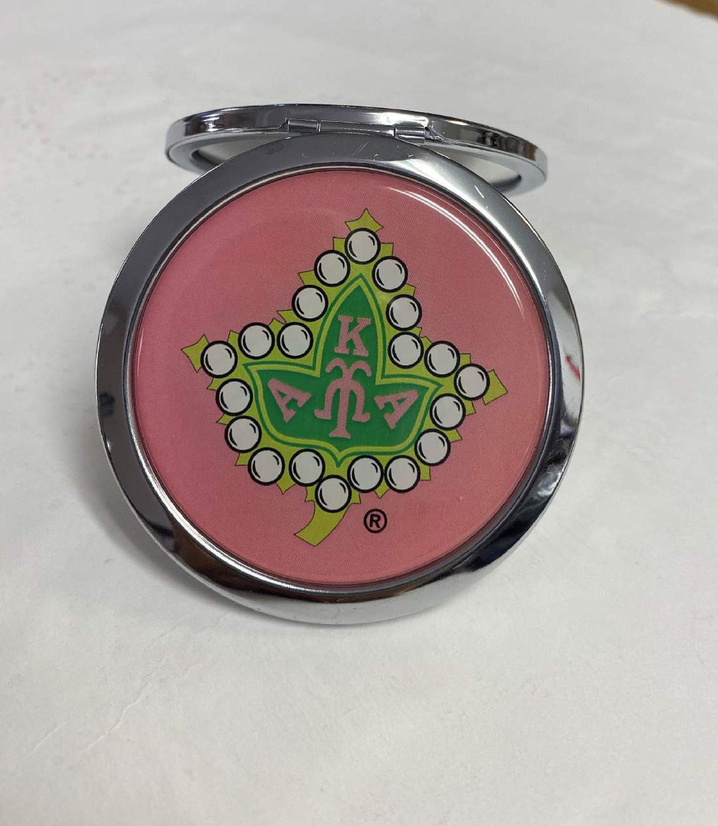 Alpha Kappa Alpha (AKA) Pink and Green color Pocket Mirror/ Compact Mirror with Ivy Leaf print on it, Made in China.