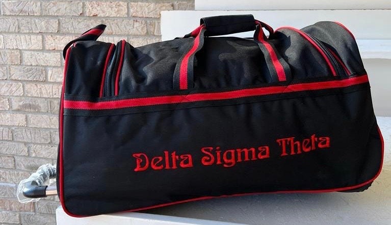 Delta Sigma Theta (DST) Red & Black color Trolley/ Duffle/ Luggage Bag for travelling.- authorized vendor