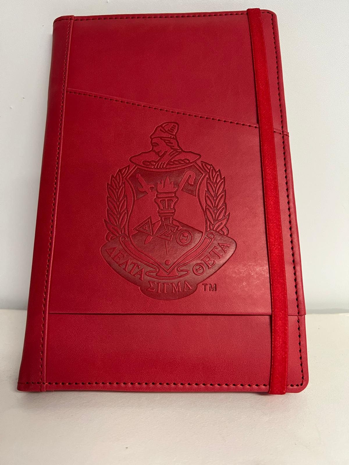 Delta Sigma Theta (ΔΣΘ) Sorority Artificial Leather NOTEBOOK- organizational shield print on front Red Color.