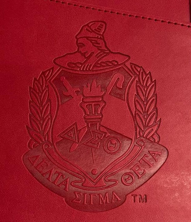 Delta Sigma Theta (ΔΣΘ) Sorority Artificial Leather NOTEBOOK- organizational shield print on front Red Color.
