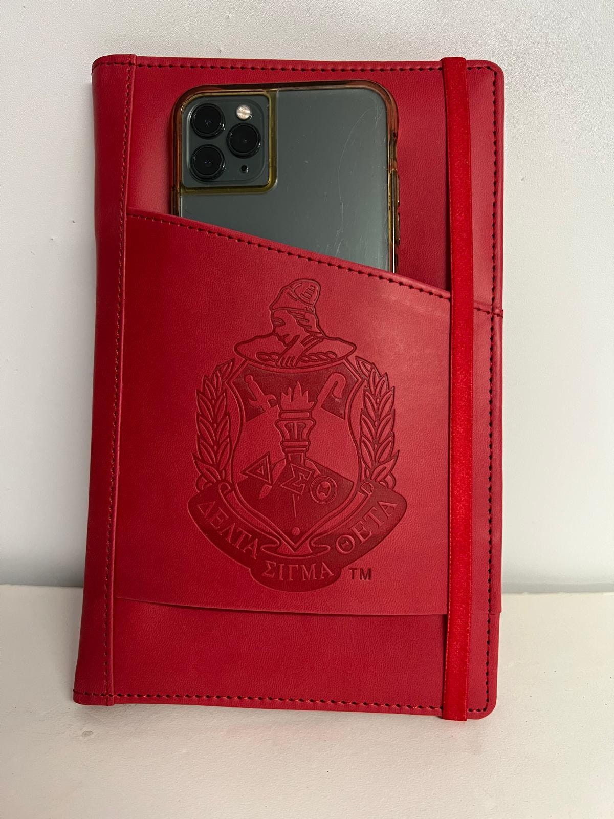 Delta Sigma Theta (ΔΣΘ) Sorority Artificial Leather NOTEBOOK- organizational shield print on front Red Color.