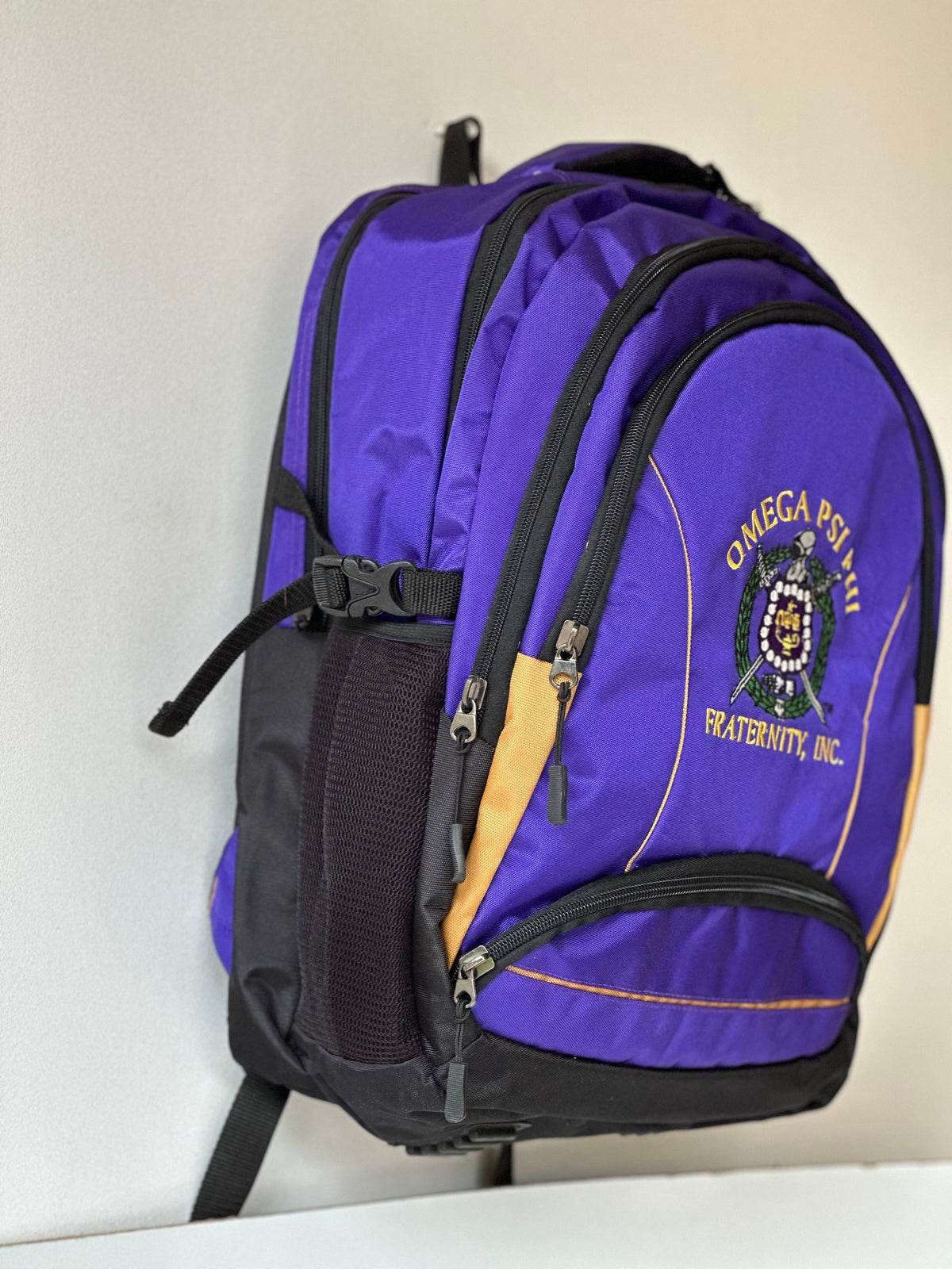 Omega Psi Phi (ΩΨΦ) Fraternity, Purple & gold Stylish, Polyester Fabric Coated College Backpack with laptop sleeves For Men, Made in India.