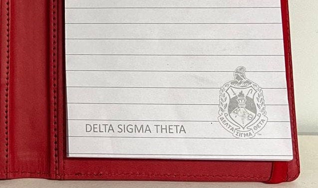 Delta Sigma Theta (ΔΣΘ) Sorority Artificial Leather NOTEBOOK- organizational shield print on front Red Color.