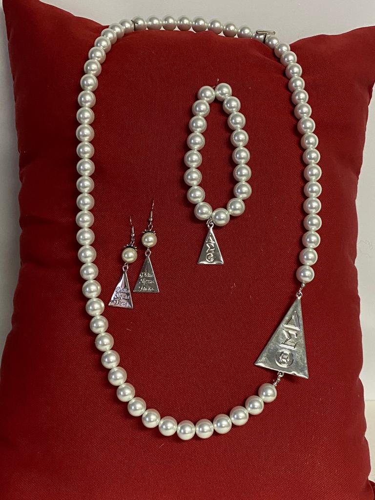 White pearls with silver triangle set